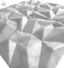 A close-up, 3D rendered view of a white marble-patterned wall panel with a geometric, faceted design. Produktbild-Vorschau