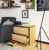 A modern living room scene featuring a nightstand next to a sofa, with shelves and a floor lamp. Produktbild-Vorschau