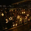 String lights with star and moon shapes hanging on a balcony railing at night. Náhľad obrázku produktu