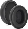 Two black ear pads for headphones are shown against a white background. One ear pad is shown from the side, revealing its foam interior, while the other is shown from the front with an 'R' embossed on it. Podgląd zdjęcia produktu