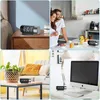 Collage of four images showing a digital alarm clock in different home settings: on a nightstand, in a kitchen, on a coffee table, and on a desk. Produktbild-Vorschau