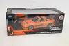 A toy car in its packaging, with a figure of Vin Diesel and the Fast & Furious logo. Anteprima dell’immagine prodotto