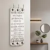 A wooden coat rack with a motivational quote is mounted on a wall, with a console table and mirror in the background. Produktbild-Vorschau