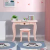 A child's pink vanity desk and stool set in a room with pink and gray walls. Podgląd zdjęcia produktu