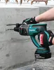 A person is using a Makita rotary hammer drill to drill into a concrete wall. Produktbild-Vorschau