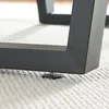Close-up of a table leg with an adjustable foot on a carpet. Náhled obrázku produktu