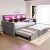 A modern daybed with a pull-out trundle bed, featuring built-in shelving and LED lighting. Voir les images du produit