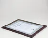A framed certificate or document is displayed on a white background. Produktbild-Vorschau