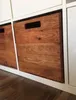 Close-up of a wooden crate inserted into a white shelving unit. Produktbild-Vorschau