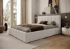 A bedroom scene featuring a bed with bedding, a rug, and decorative elements. Produktbild-Vorschau