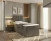 A bedroom setting with a bed, nightstand, and wardrobe. Náhled obrázku produktu