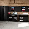 A black storage cabinet system with various compartments and shelves, against a brick wall and concrete floor. Anteprima dell’immagine prodotto