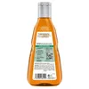 The back of an orange shampoo bottle with product information and a barcode. Produktbild-Vorschau