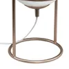 Close-up of the base of a table lamp, showing the stand and power cord. Produktbild-Vorschau