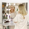 A woman is applying makeup in front of a vanity mirror with LED lights. Voir les images du produit