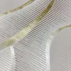 A close-up view of a textured rug with a pattern of curved lines and stripes. Produktbild-Vorschau