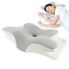 A woman sleeping on an ergonomic pillow, with a close-up view of the pillow in the foreground. Produktbild-Vorschau
