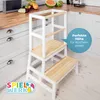 A white and wood learning tower is placed in a kitchen setting. Anteprima dell’immagine prodotto