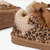 Close-up view of a leopard-print winter boot. Produktbild-Vorschau