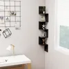 A corner of a room with a desk, a lamp, and a wall-mounted shelf unit. Náhľad obrázku produktu