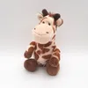 A plush giraffe toy is sitting on a white background. Produktbild-Vorschau