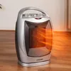 A portable electric heater with orange glowing heating elements is shown on a wooden floor. Podgląd zdjęcia produktu