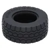 A close-up studio shot of a single black LEGO tire. Náhled obrázku produktu