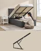A woman is putting pillows into a storage bed. Below is an image of the bed's hydraulic lift mechanism. Náhled obrázku produktu