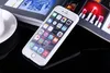A white iPhone with a white case is placed on a black reflective surface next to an open magazine. Produktbild-Vorschau