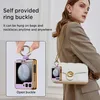 A woman is shown wearing a handbag with a small purple and gold accessory attached to it. The accessory is also shown in a close-up inset demonstrating its ring buckle feature. Produktbild-Vorschau