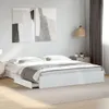 A white bed frame with drawers in a bedroom setting. Produktbild-Vorschau