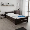 A bedroom scene with a bed, nightstand, and dresser. Produktbild-Vorschau