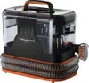 A black and orange carpet cleaner with a transparent water tank and a coiled hose. Voir les images du produit