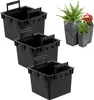 Three black plastic pot inserts are arranged in a staggered formation against a white background. To the right, two grey, textured planters hold plants, one larger with a fern and red flowers, and a smaller one with a green plant. Produktbild-Vorschau