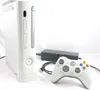 A white Xbox 360 console with a white controller and power brick are displayed on a white background. Produktbild-Vorschau