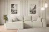 A modern living room setup featuring a sectional sofa, two pieces of abstract art, and pendant lighting. Produktbild-Vorschau