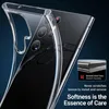 A clear phone case is shown on a dark background, highlighting its transparency and flexibility. Voir les images du produit