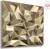 A 3D geometric wall panel with a metallic gold finish.