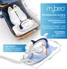 A travel iron is shown inside an open suitcase next to a pair of white sneakers, with marketing text and dimensions provided. Podgląd zdjęcia produktu