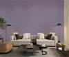 A living room scene with a sofa, coffee table, and lamps. Podgląd zdjęcia produktu