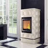 A cream-colored tiled fireplace with a fire burning inside, placed on a black and white checkered floor in a room with large French doors. Anteprima dell’immagine prodotto