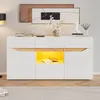 A modern white sideboard with natural wood accents and LED lighting, displayed in a well-lit room with artwork and decor. Podgląd zdjęcia produktu