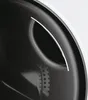 A close-up view of the interior of a washing machine drum, showing a curved metallic trim and a section with small perforations. Produktbild-Vorschau