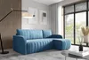 A modern living room with a blue sectional sofa, a floor lamp, and a large window.