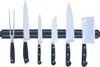 A set of kitchen knives and a carving fork are displayed on a magnetic knife strip against a white background. Náhled obrázku produktu