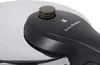 A close-up view of the lid and handle of a pressure cooker. Náhled obrázku produktu