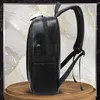 A black rucksack is shown from the side on a wooden stand against a marble-like background with gold veins. Anteprima dell’immagine prodotto