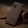 A brown leather flip case for a smartphone is displayed on a textured brown surface. Produktbild-Vorschau