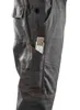 Close-up of a gray work pant pocket with an orange measuring tape inside. Produktbild-Vorschau