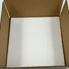 An empty cardboard box with white styrofoam padding. Voir les images du produit